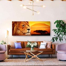 Πίνακας σε καμβά Lion portrait on savanna. Mount Kilimanjaro at sunset.