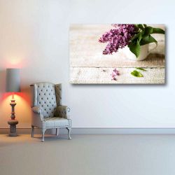 Πίνακας σε καμβά Purple lilac bouquet laid on wooden table
